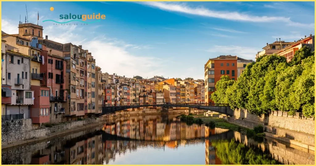 **Alternative text:**
*Girona’s medieval old town glowing beside the Onyar River, where colourful houses and ancient streets tell timeless Catalan stories*